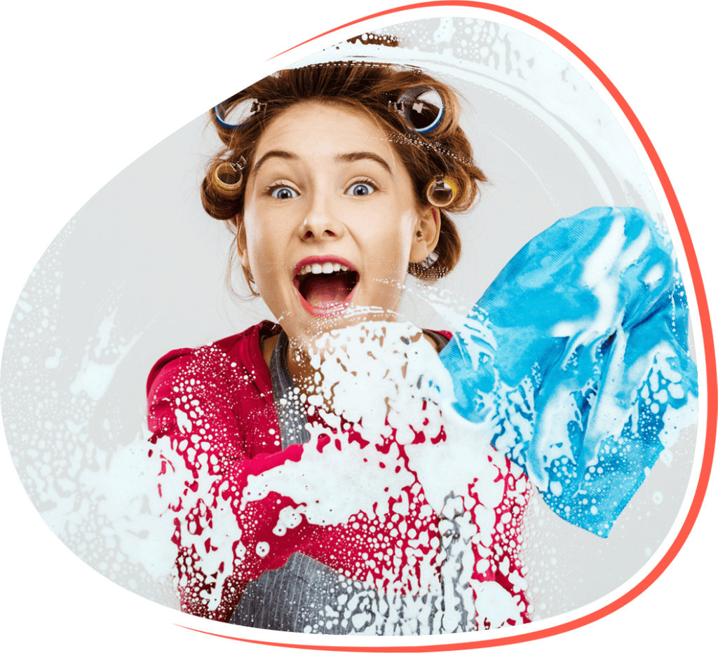 CLEANING FUN: Young girl with curlers in hair enjoying soapy bubble play during home cleaning.