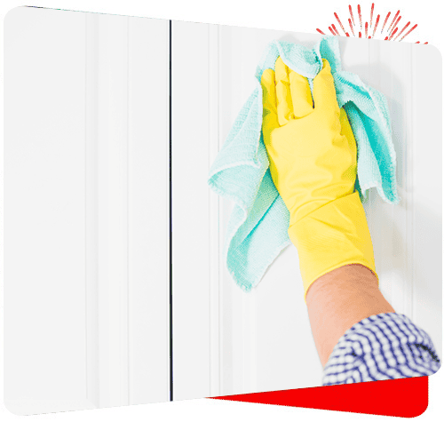 Microfiber cleaning cloth being used on a white cabinet for spotless cleaning.
